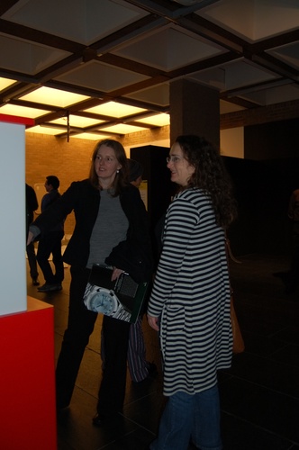 Tania Creighton and Brigid Costello in front of "Just a Bit of Spin" by Costello
